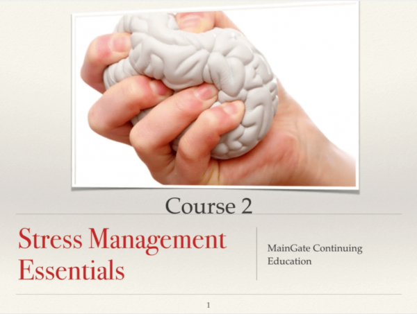 Hand grasping stress ball shaped like brain